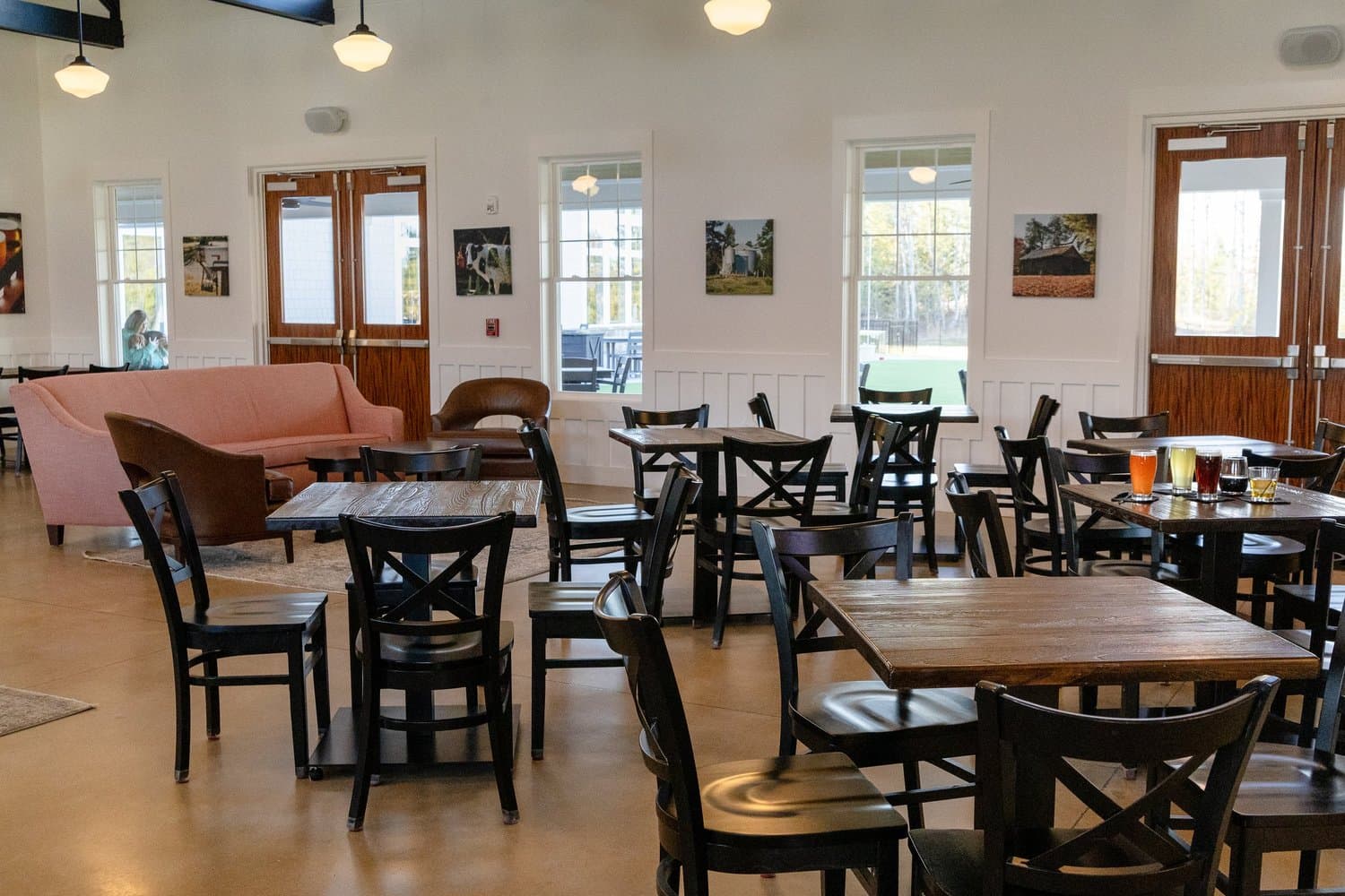 Dining tables inside the light-filled taproom